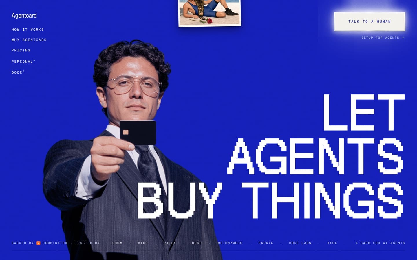 Agent Card's hero: a man in a suit holding a black card toward the viewer on deep blue, beside pixelated headline type.
